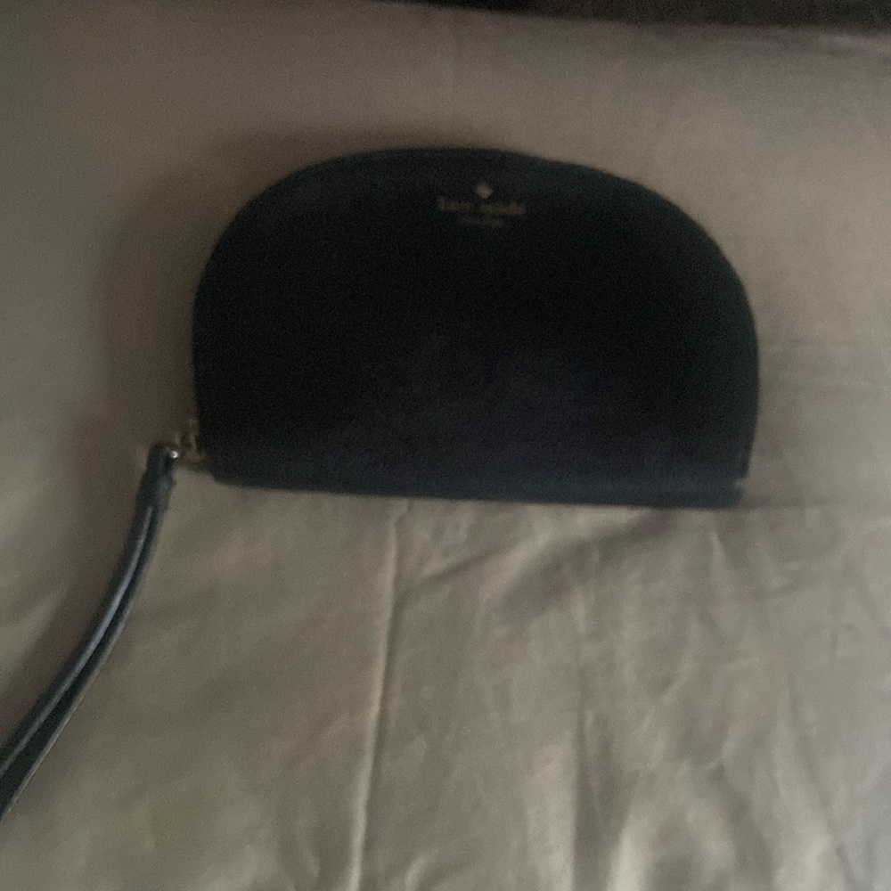 Kate Spade gently used black leather wrist let.